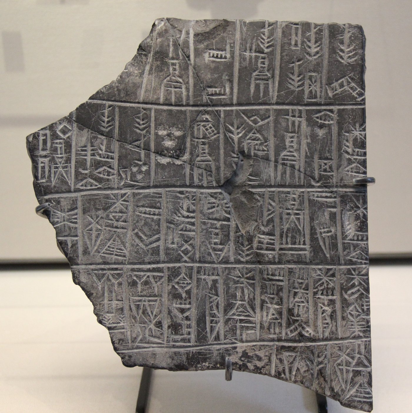 A Sumerian cuneiform tablet. Mesopotamian scribes recorded beer rations, recipes, and the Hymn to Ninkasi in this script.