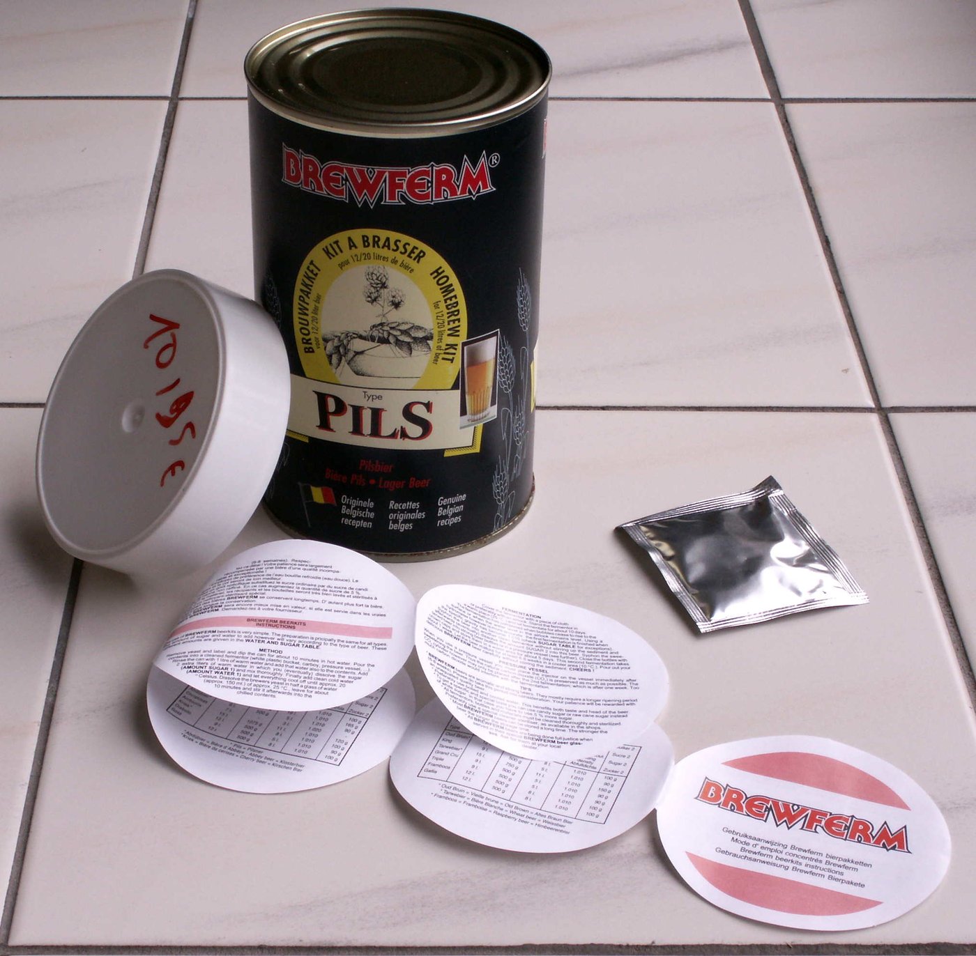 A canned malt-extract beer kit. At Tier-1 the fermentable sugar arrives pre-made as liquid or dry malt extract — the maltster has done the mash for you.